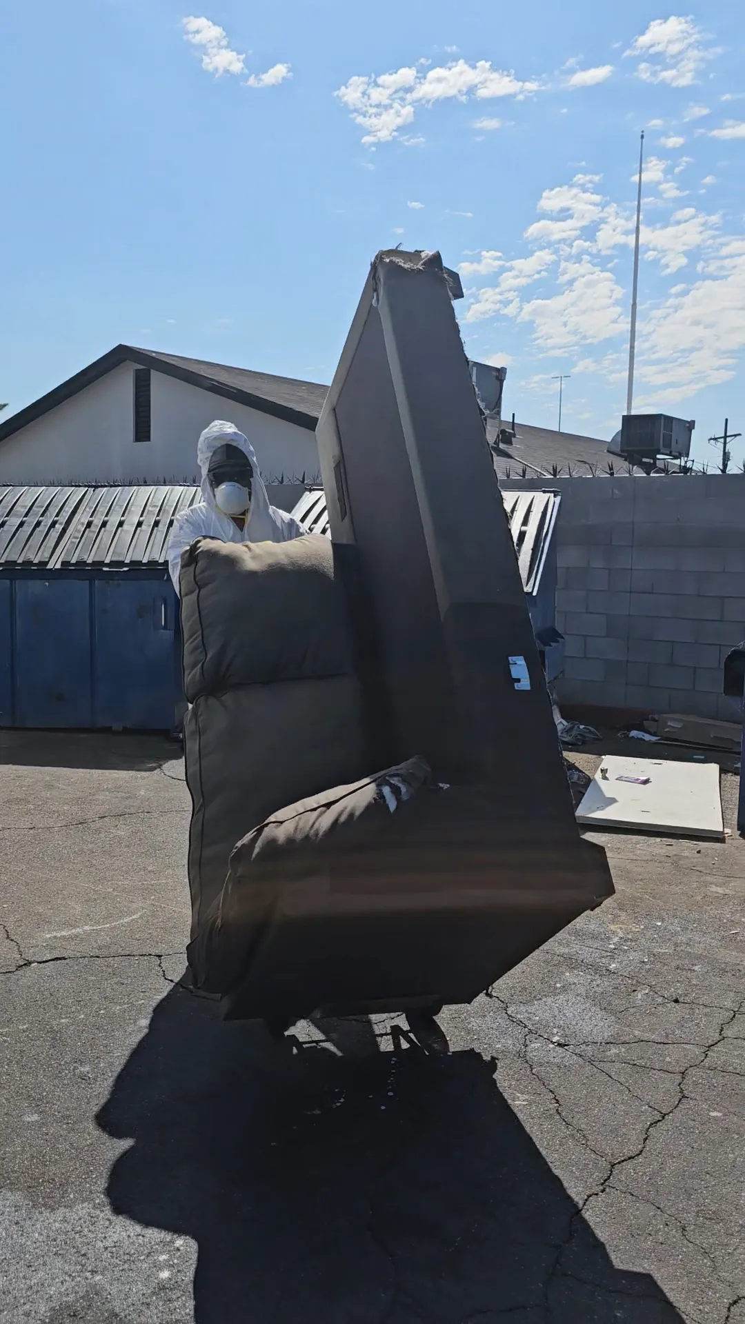 Professional handling of bed bug infested furniture, emphasizing safety and proper containment during junk removal.